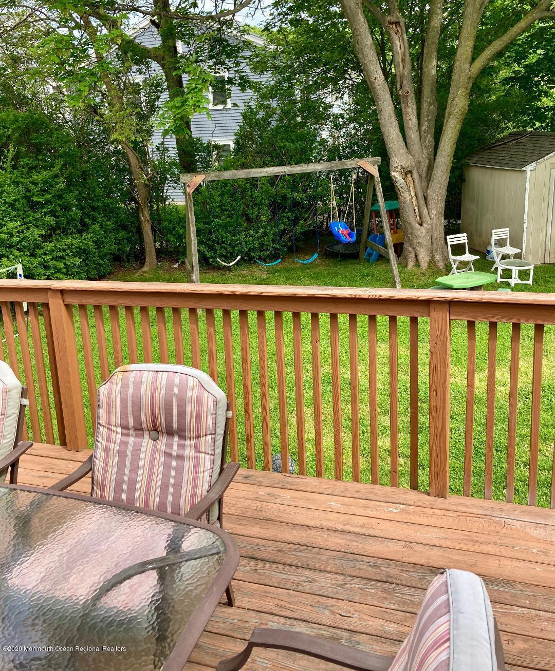 3 Cedar Avenue, Unit UPSTAIRS Long Branch, NJ 07740 - Photo 8 of 14 a view of roof deck with furniture