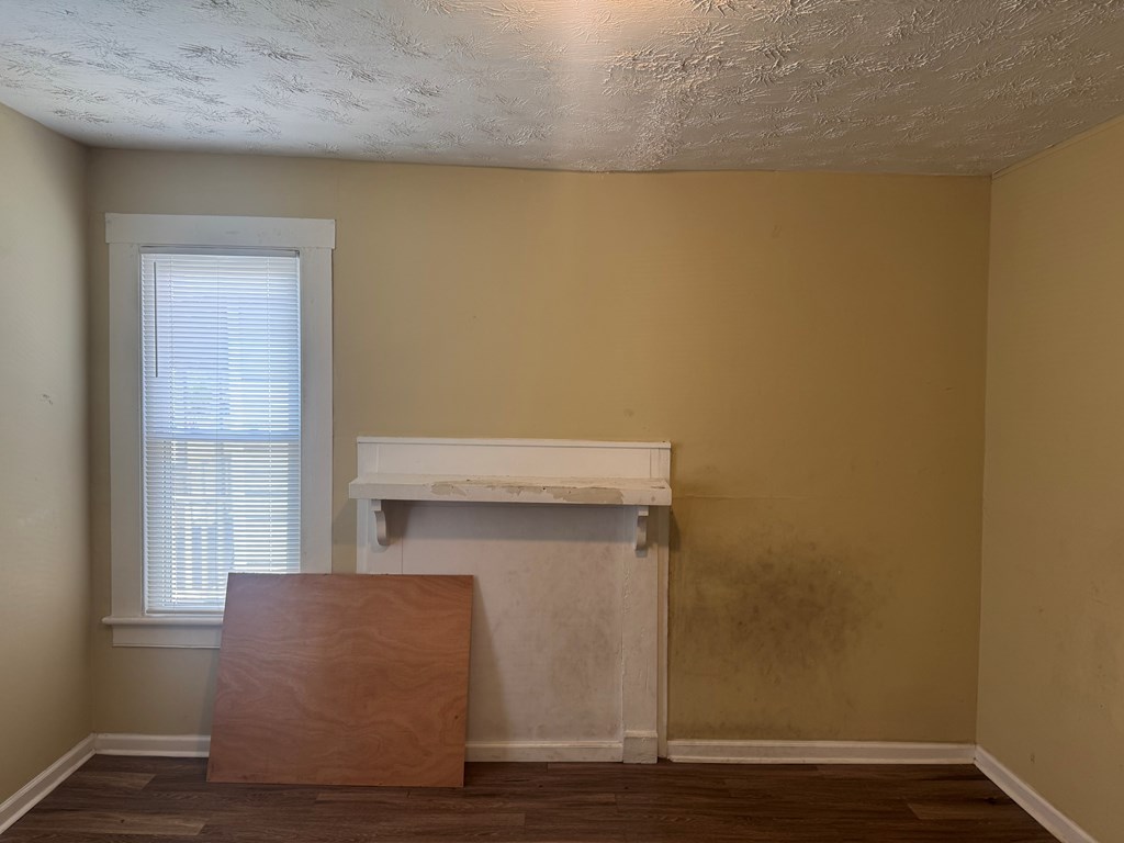 1312 22nd Street Columbus, GA 31901 - Photo 7 of 11 a room with a wooden floor and a window