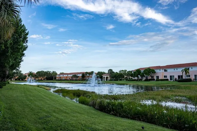 a view of a lake with houses in the background
