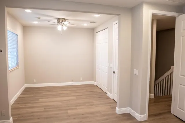 wooden floor in an empty room with a window