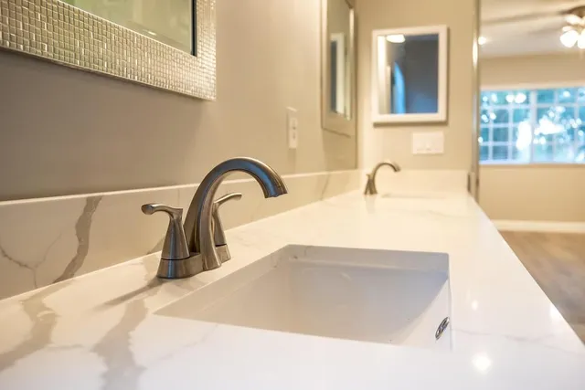 a close view of a sink and a faucet in a bathroom