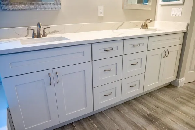 a bathroom with a sink and mirror