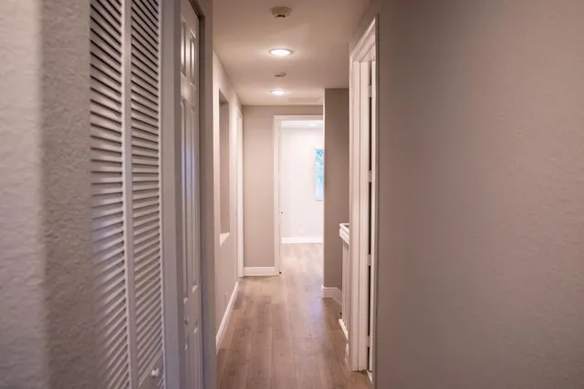 a view of hallway with livingroom