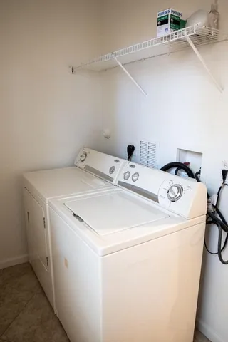 a utility room with dryer and washer