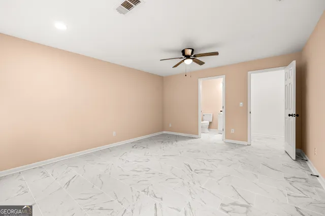 view of a hallway with wooden shelves