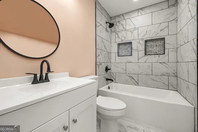 an empty room with a window and a ceiling fan