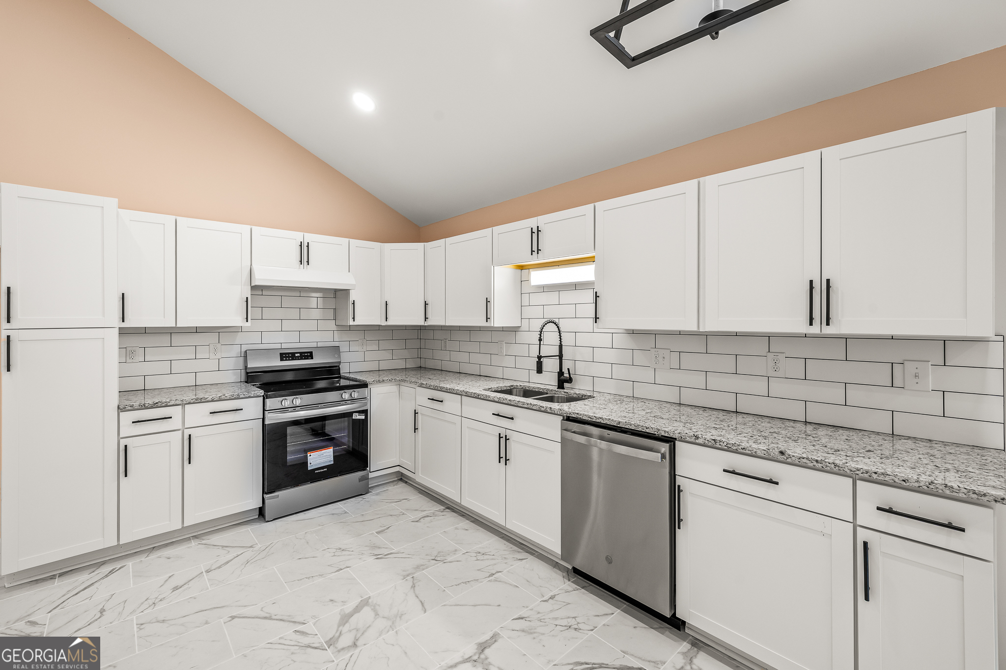 596 Watson Street Toccoa, GA 30577 - Photo 8 of 25 a kitchen with stainless steel appliances granite countertop a sink stove and cabinets