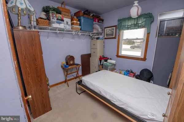 a bedroom with bed and a window