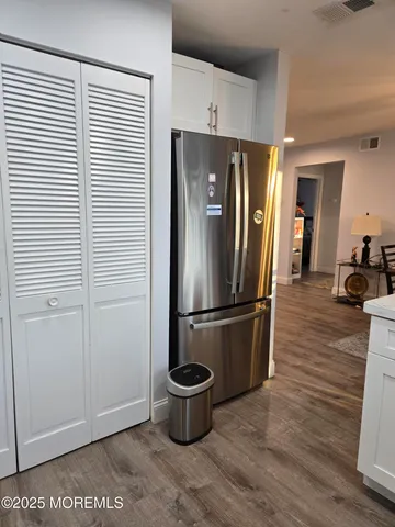 a kitchen with a refrigerator and a stove