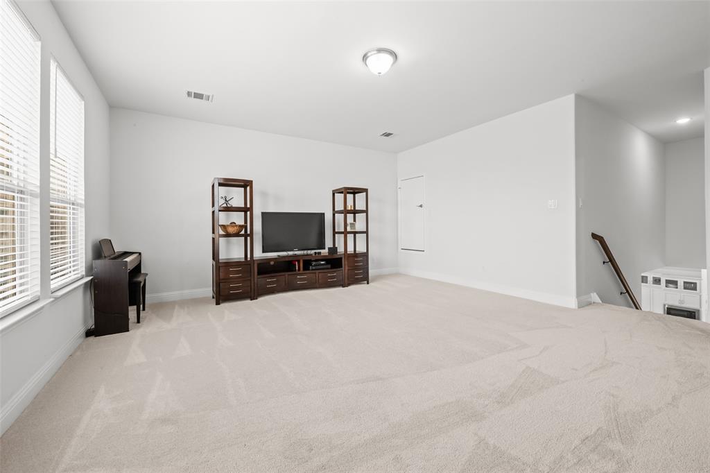 1712 Birch Street Mansfield, TX 76063 - Photo 20 of 35 a view of a livingroom with furniture and a flat screen tv