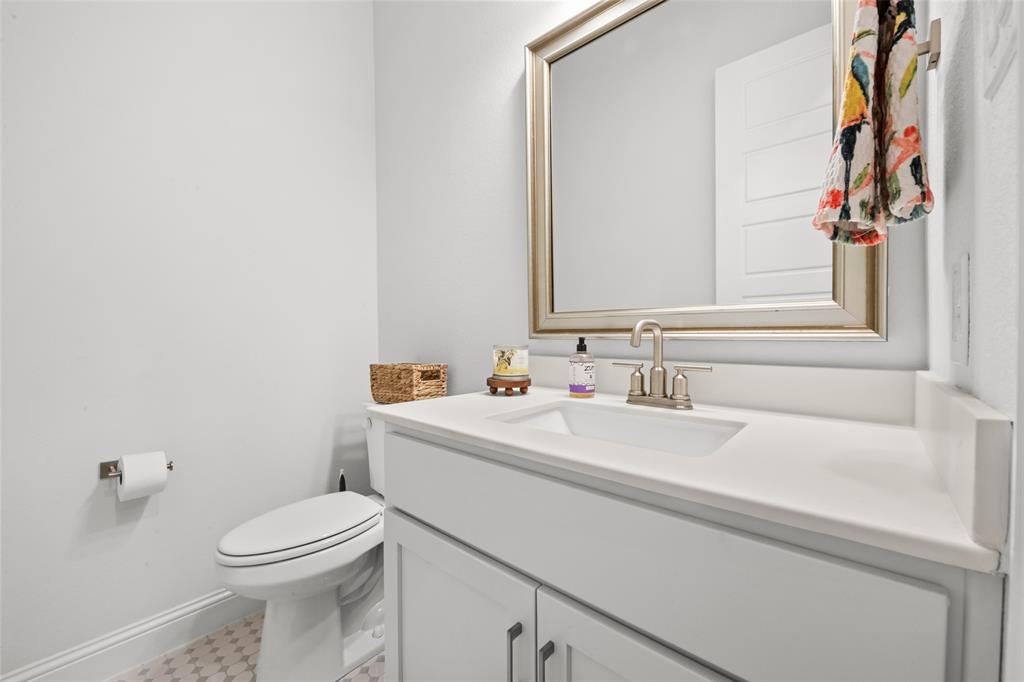 1712 Birch Street Mansfield, TX 76063 - Photo 25 of 35 a bathroom with a sink and a toilet