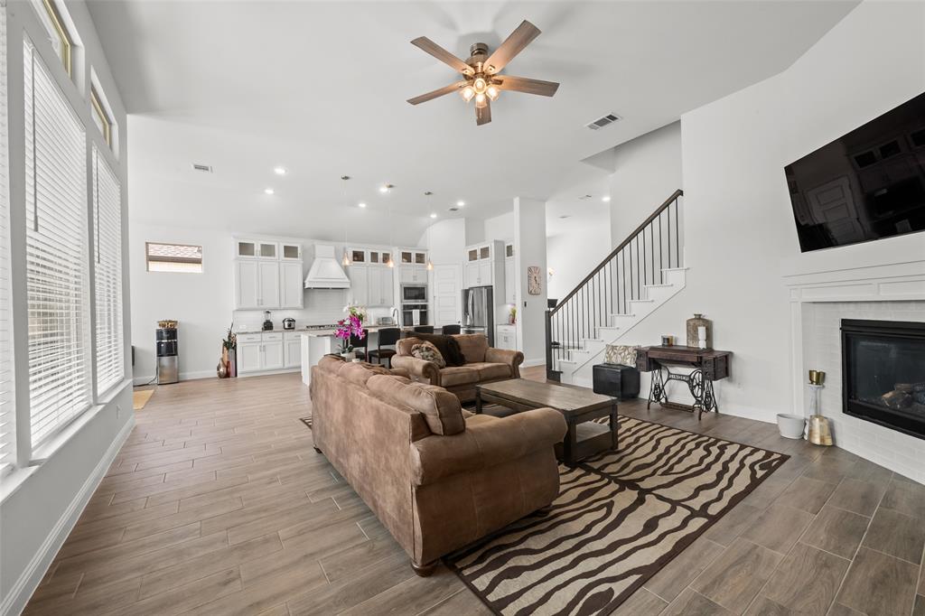 1712 Birch Street Mansfield, TX 76063 - Photo 9 of 35 a living room with furniture fireplace and flat screen tv