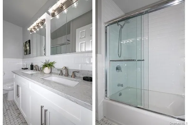 a bathroom with a granite countertop sink a mirror and shower