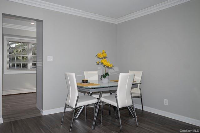 113 Terrace, Unit T01113 Bayport, NY 11705 - Photo 6 of 13 a view of a dining room with furniture and wooden floor