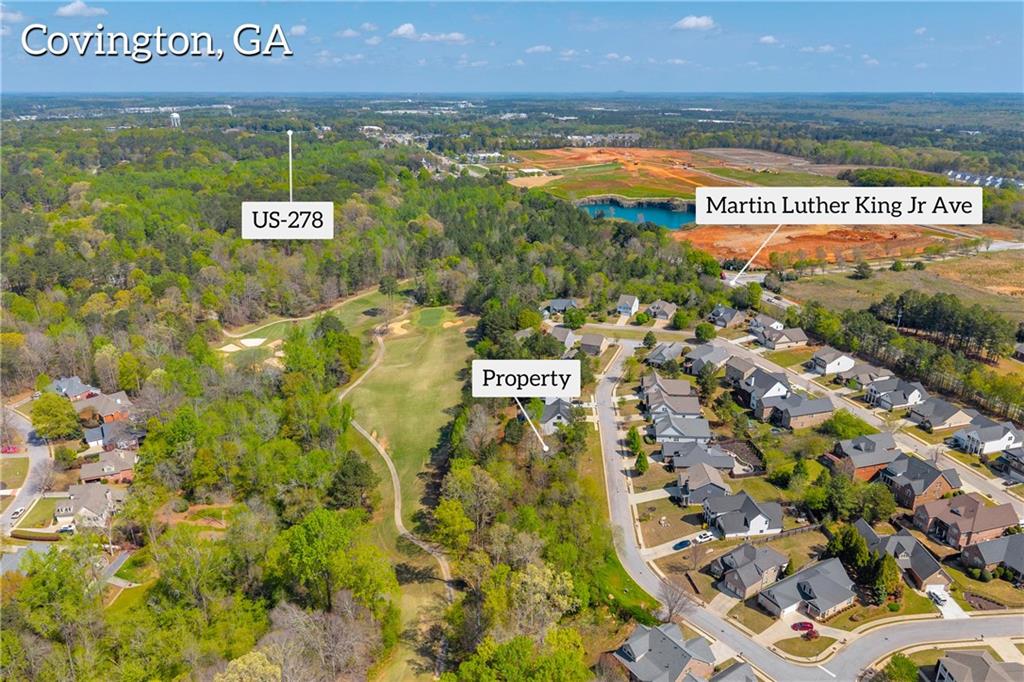 9153 Golfview Lane Covington, GA 30014 - Photo 4 of 10 a view of swimming pool with an outdoor space and seating area