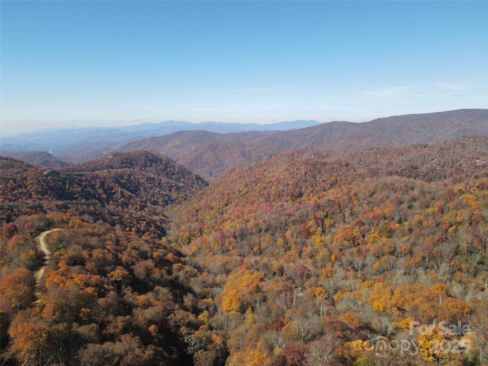 3837-3689 Plott Balsam Road Maggie Valley, NC 28751 - Photo 23 of 36 an aerial view of house with yard and mountain view in back