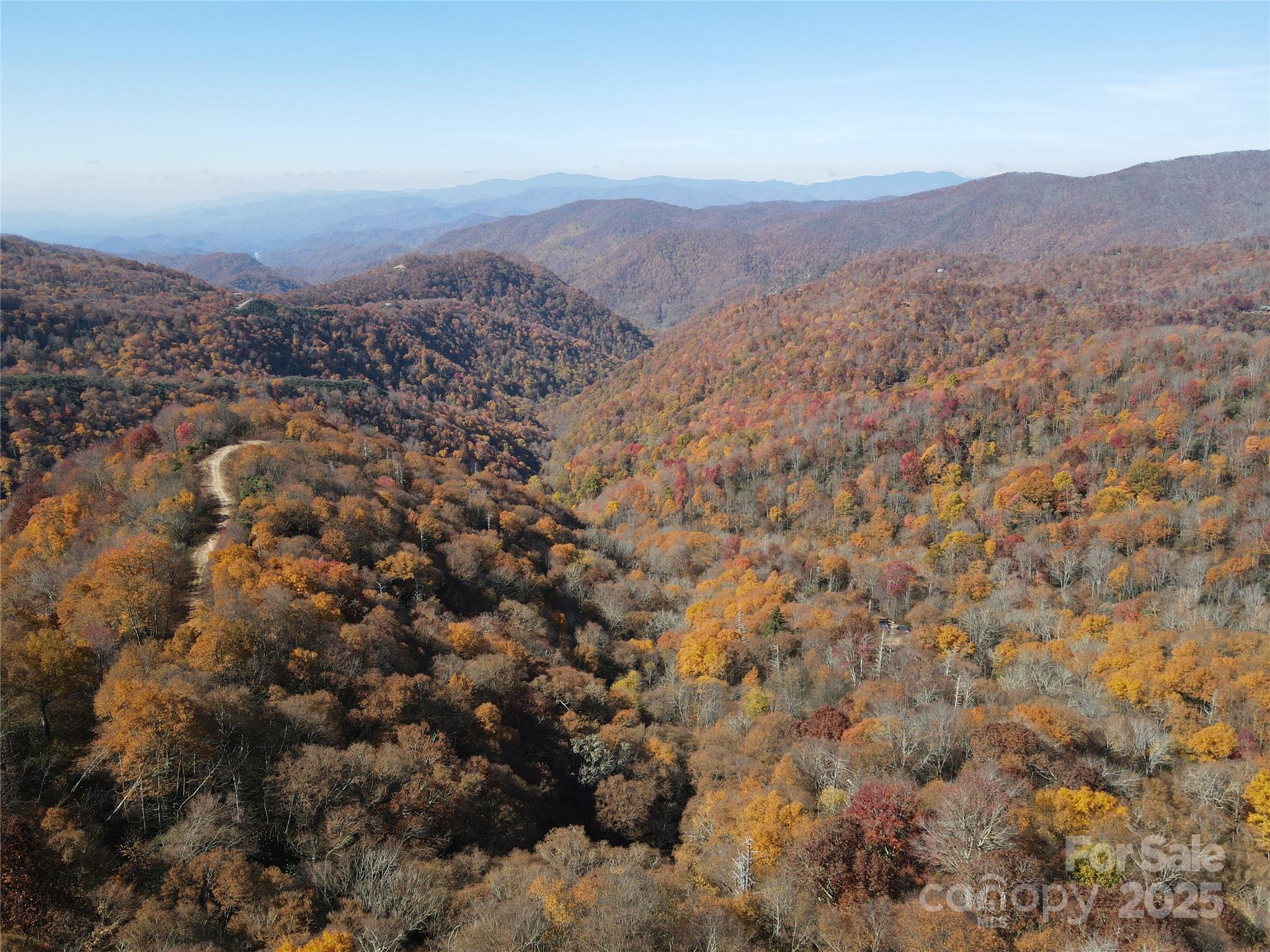 3837-3689 Plott Balsam Road Maggie Valley, NC 28751 - Photo 28 of 36 an aerial view of residential house and green space
