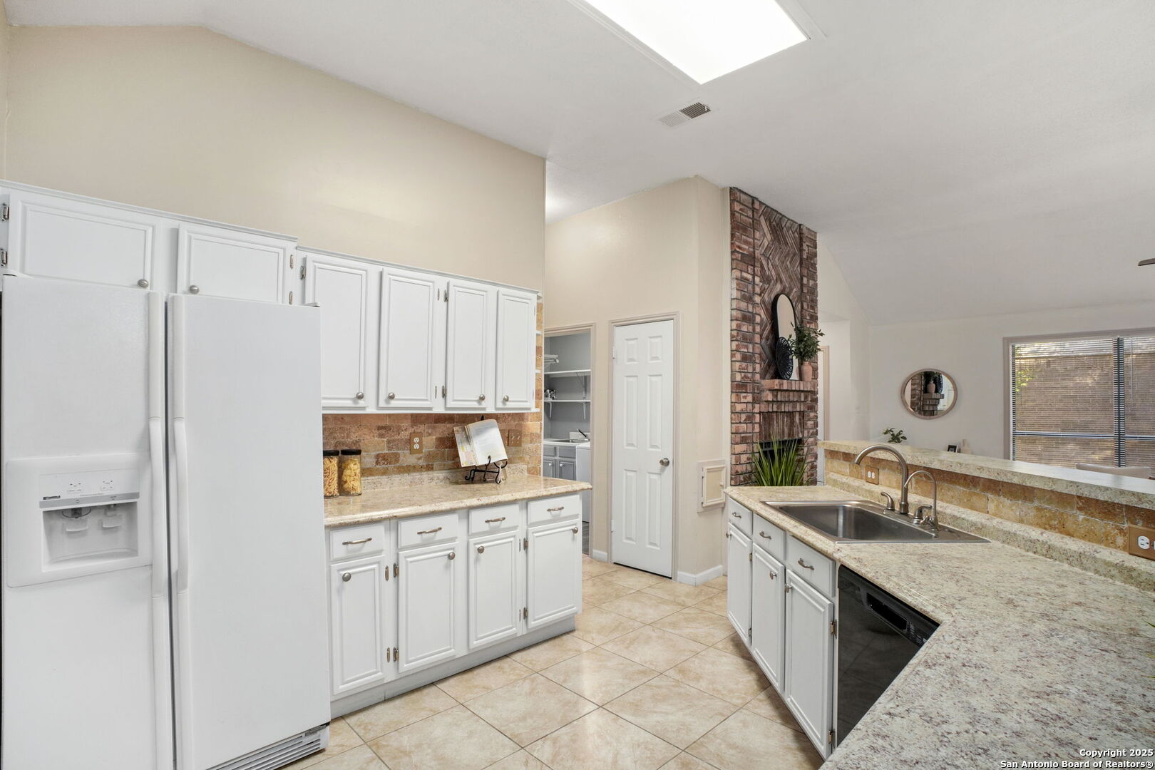 7562 Beaver Tree San Antonio, TX 78249 - Photo 11 of 30 a kitchen with a sink stove and refrigerator
