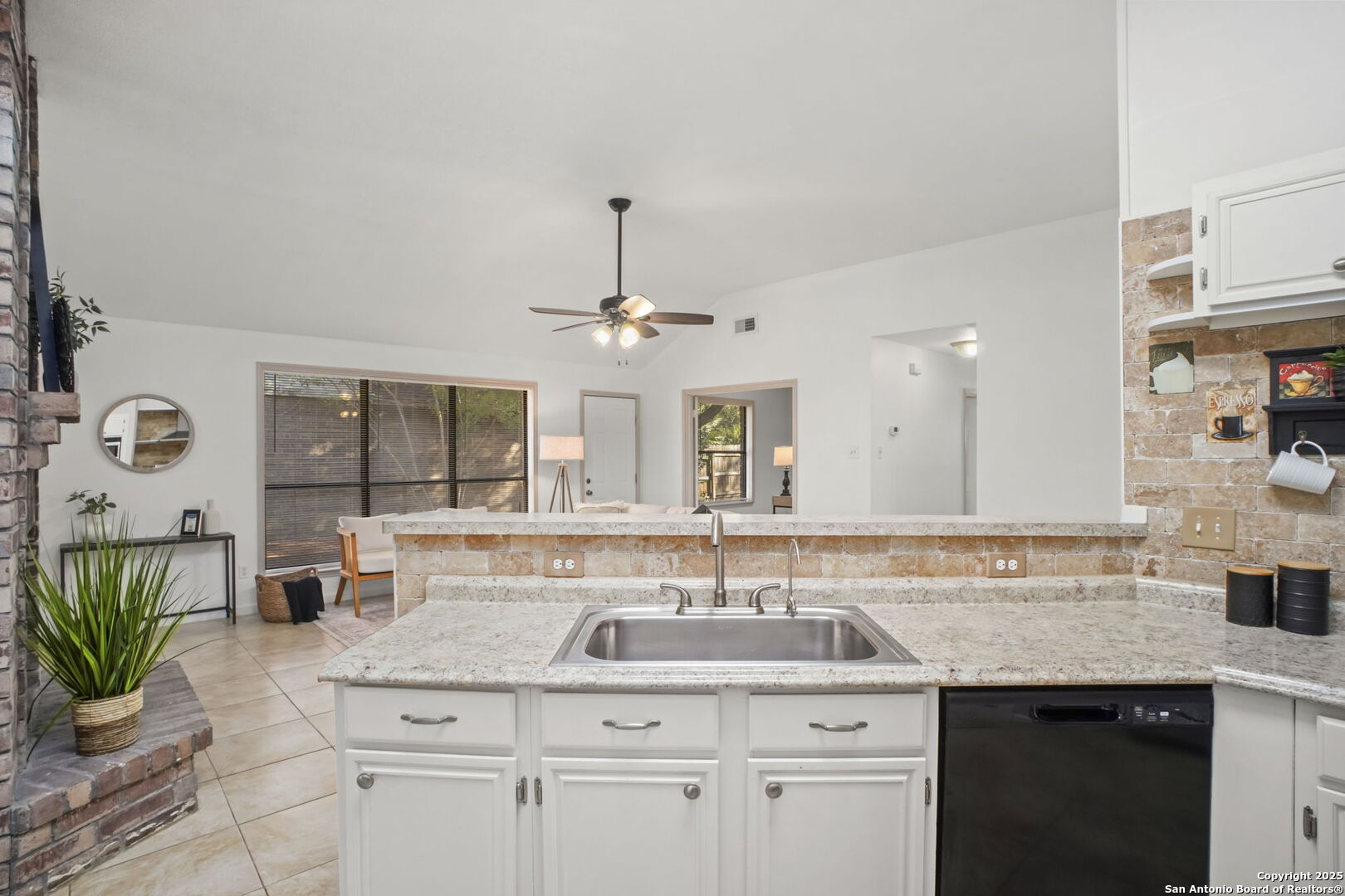 7562 Beaver Tree San Antonio, TX 78249 - Photo 13 of 30 a kitchen with a sink and a refrigerator