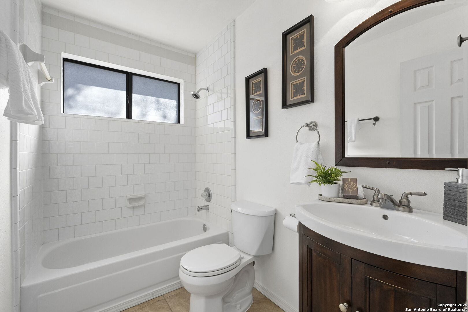7562 Beaver Tree San Antonio, TX 78249 - Photo 22 of 30 a bathroom with a bathtub shower sink mirror and toilet
