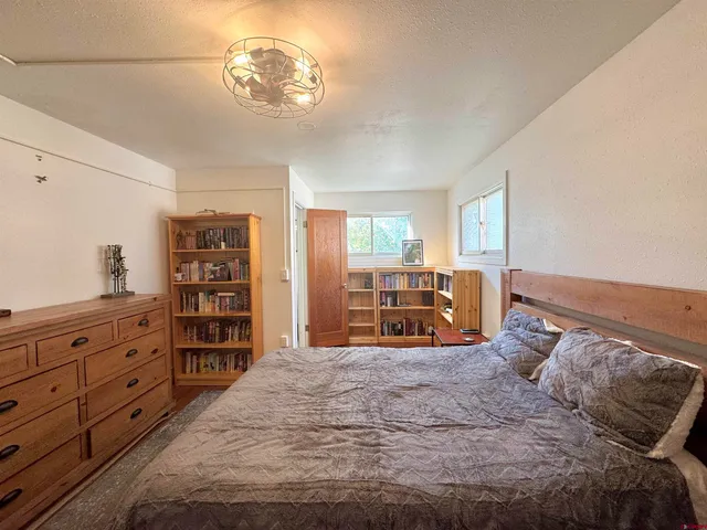 a bed room with a bed and a cabinets