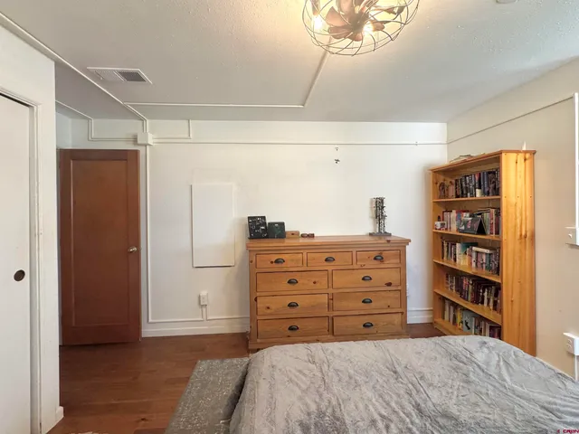 a bedroom with a bed and a closet