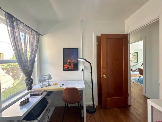 a workspace with furniture and a window