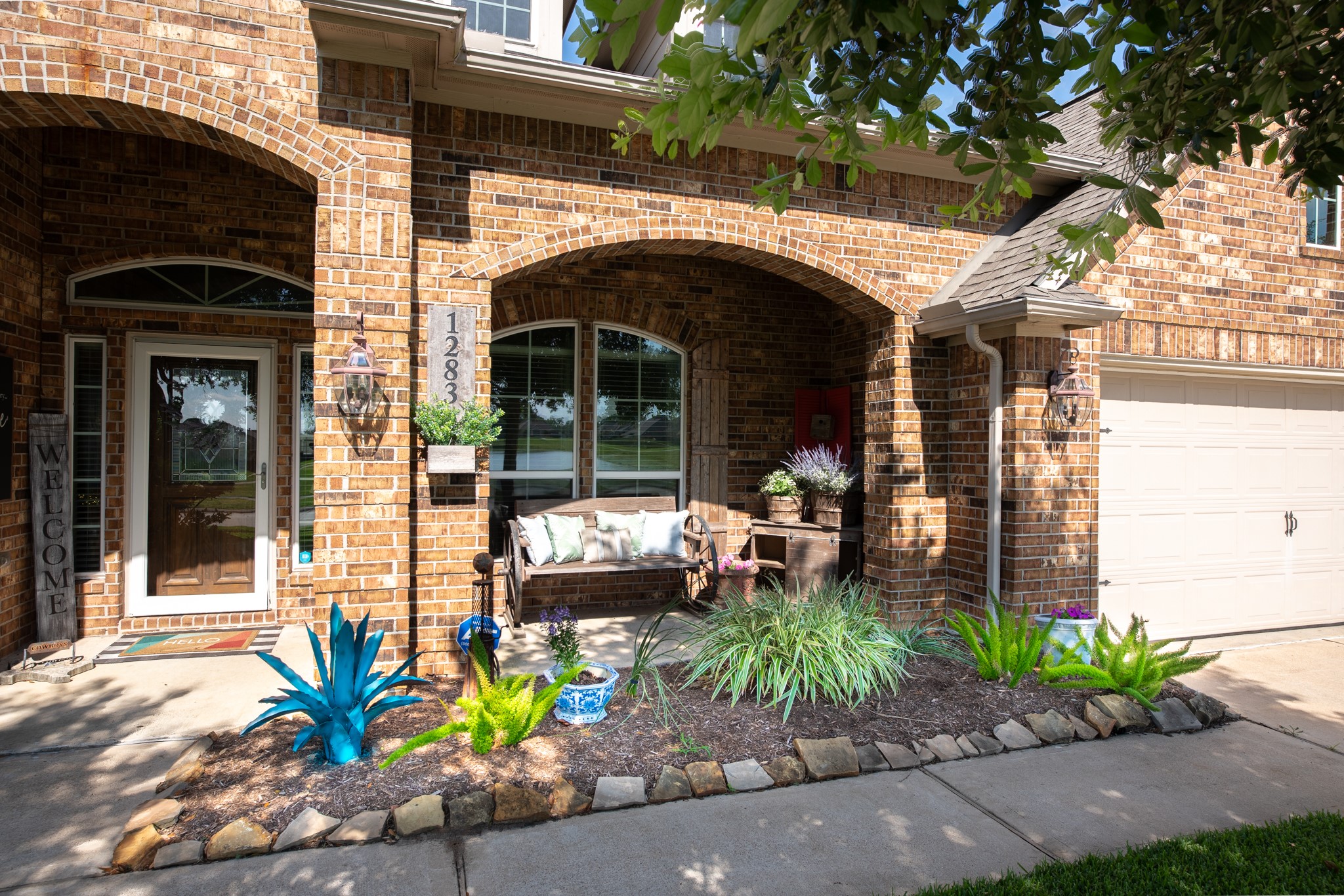 1283 Laurel Lane Angleton, TX 77515 - Photo 4 of 40 Covered front porch, nicely landscaped entrance