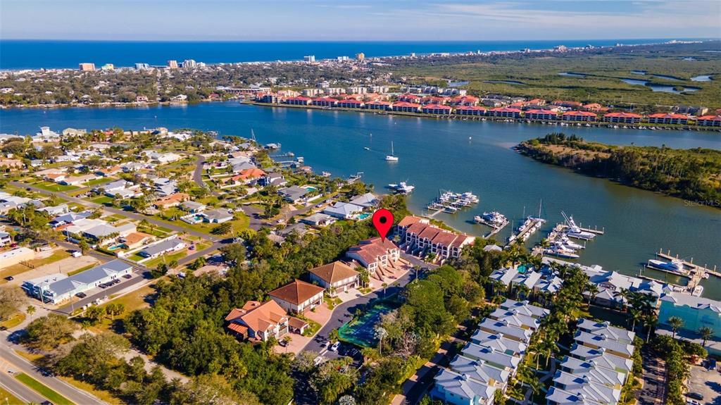 Waterfront NSB with boat dock positioned between beachside and mainland!