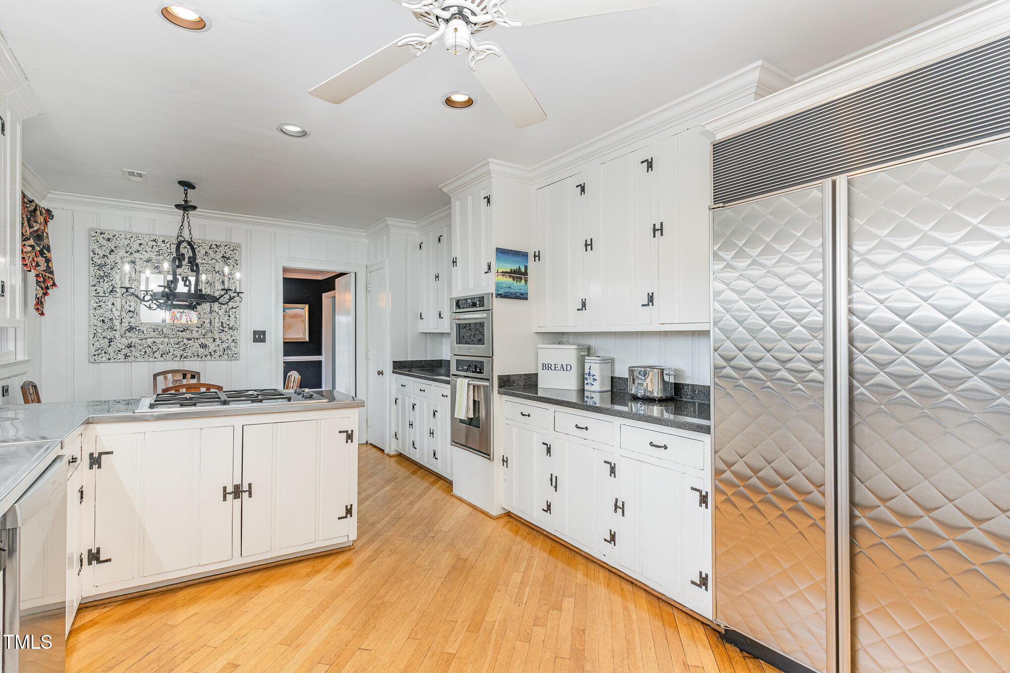 2801 Chelsea Circle Durham, NC 27707 - Photo 12 of 41 a large white kitchen with cabinets and wooden floor