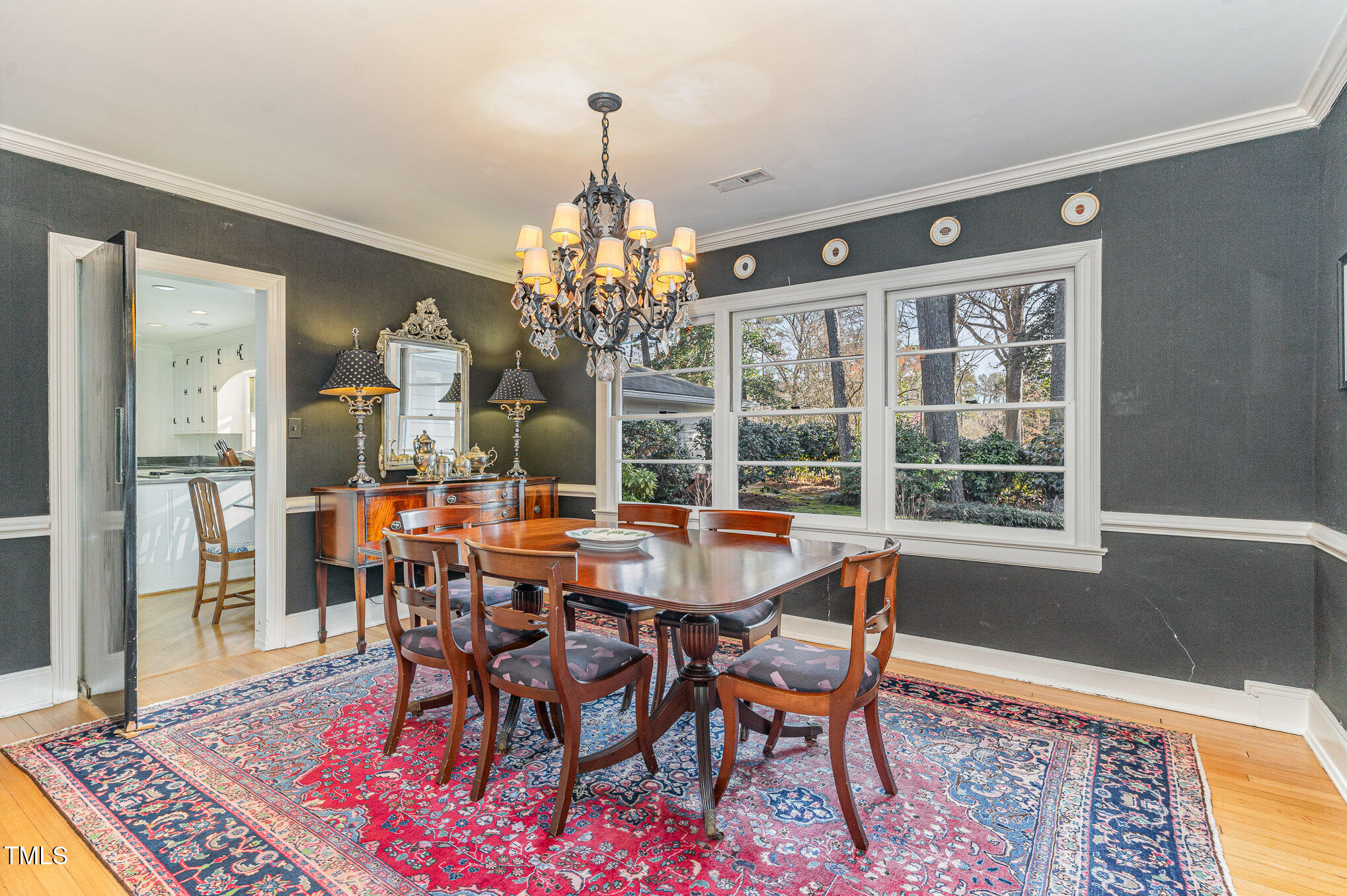 2801 Chelsea Circle Durham, NC 27707 - Photo 14 of 41 a view of a dining room with furniture wooden floor and chandelier