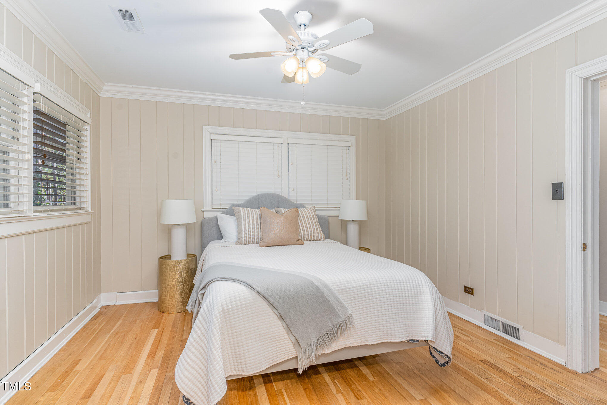 2801 Chelsea Circle Durham, NC 27707 - Photo 24 of 41 a bedroom with a bed and a chandelier