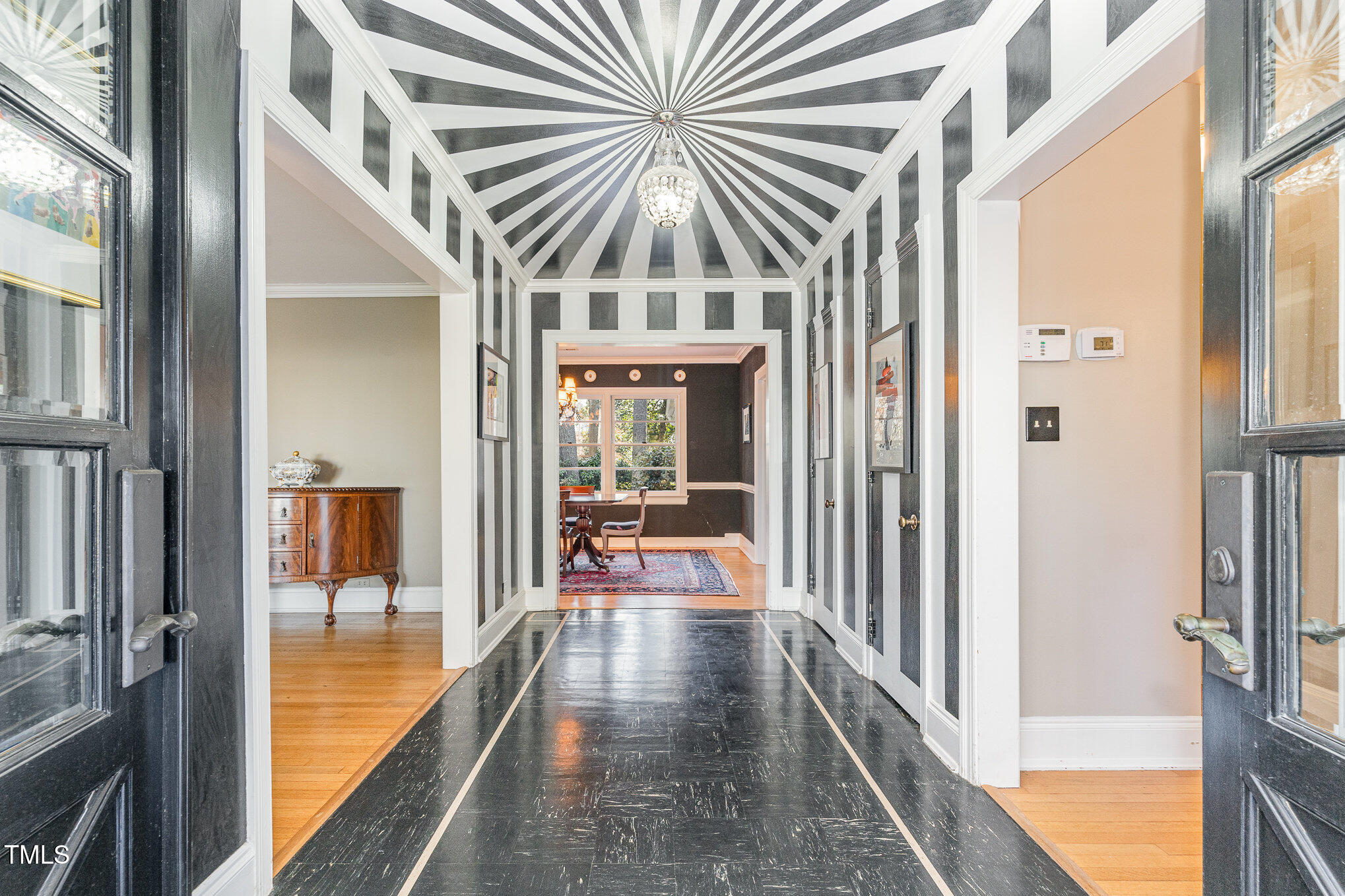 2801 Chelsea Circle Durham, NC 27707 - Photo 6 of 41 a view of a hallway with a chandelier