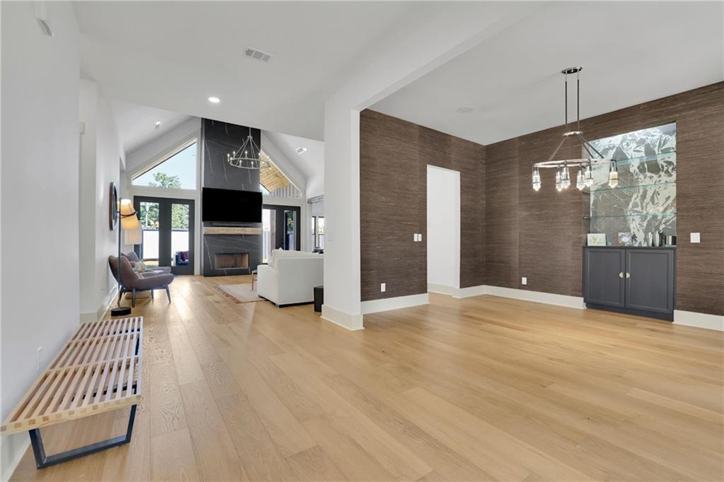 5525 Hubbard Town Road Cumming, GA 30028 - Photo 21 of 84 a view of an empty room and a kitchen with a sink