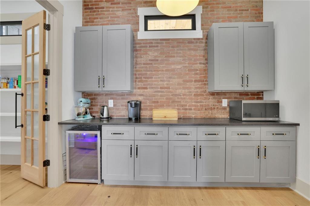 5525 Hubbard Town Road Cumming, GA 30028 - Photo 26 of 84 a kitchen with stainless steel appliances granite countertop a sink and cabinets