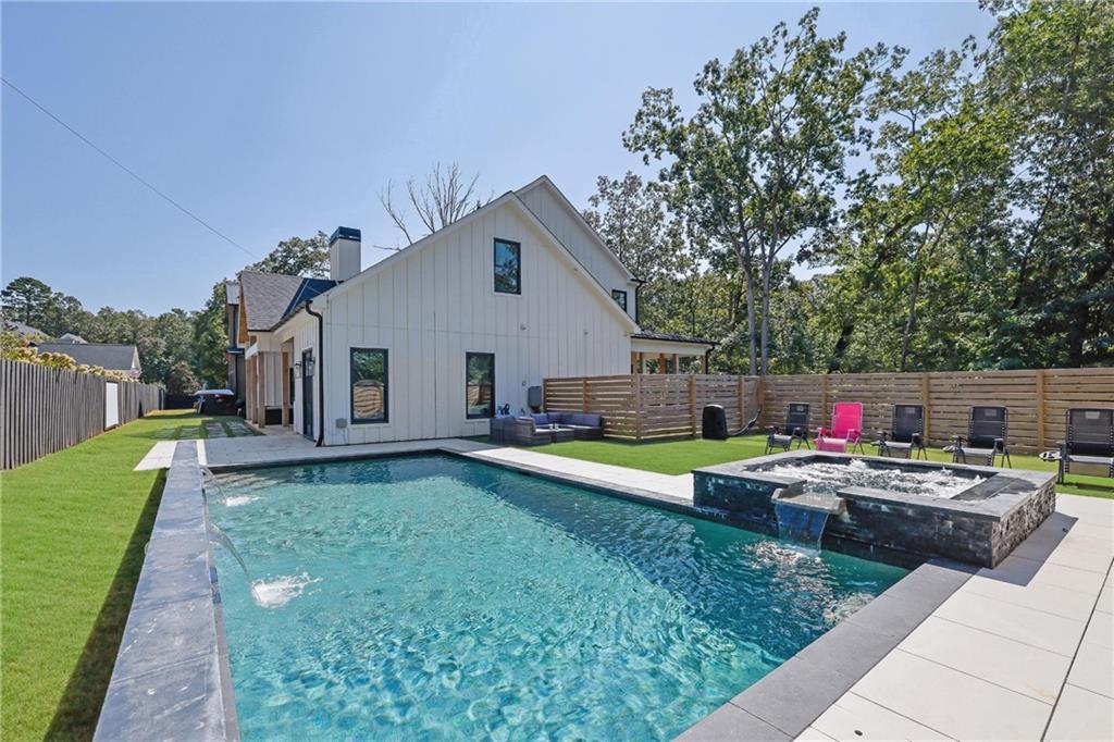 5525 Hubbard Town Road Cumming, GA 30028 - Photo 62 of 84 a aerial view of a house with swimming pool and porch