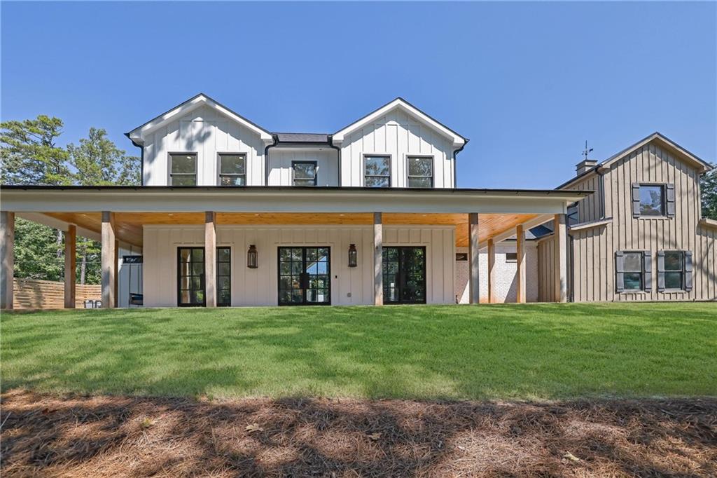 5525 Hubbard Town Road Cumming, GA 30028 - Photo 71 of 84 a front view of a house with a yard and trees