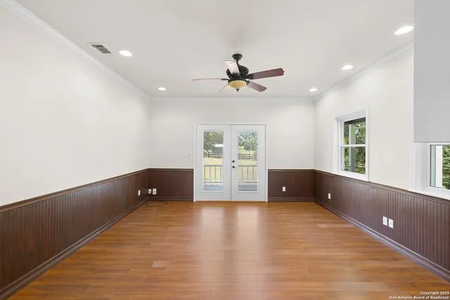 a kitchen with stainless steel appliances granite countertop a refrigerator a sink and a stove