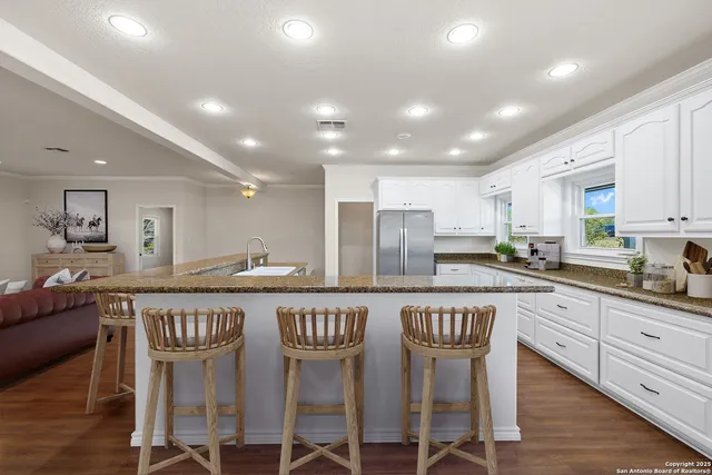 a kitchen with a stove oven and sink