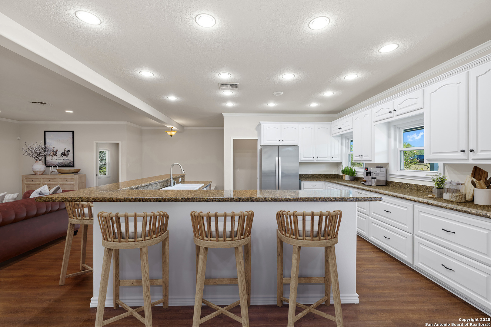 5450 Mazurek Road Schulenburg, TX 78956 - Photo 15 of 68 a kitchen with stainless steel appliances granite countertop a table chairs sink and cabinets