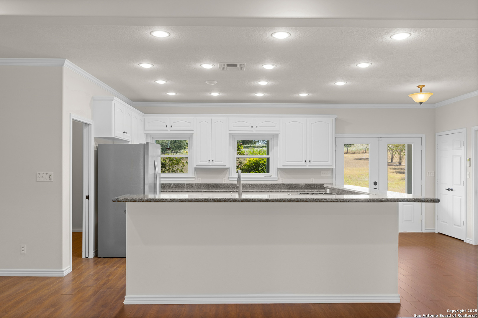 5450 Mazurek Road Schulenburg, TX 78956 - Photo 16 of 68 a kitchen with stainless steel appliances granite countertop a refrigerator a sink and a stove