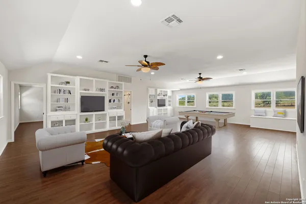 a view of kitchen and hall with wooden floor