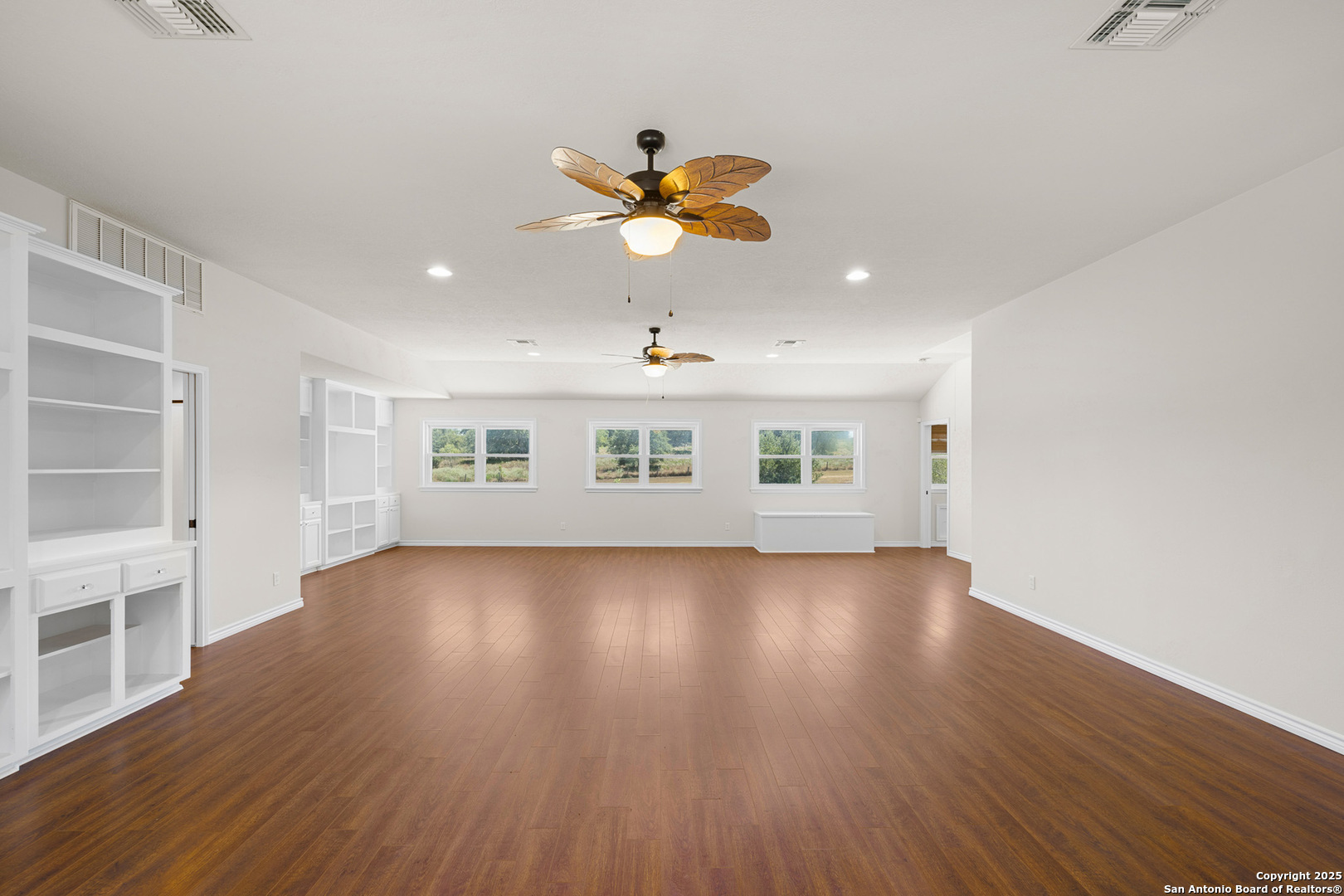 5450 Mazurek Road Schulenburg, TX 78956 - Photo 26 of 68 wooden floor in an empty room with a window