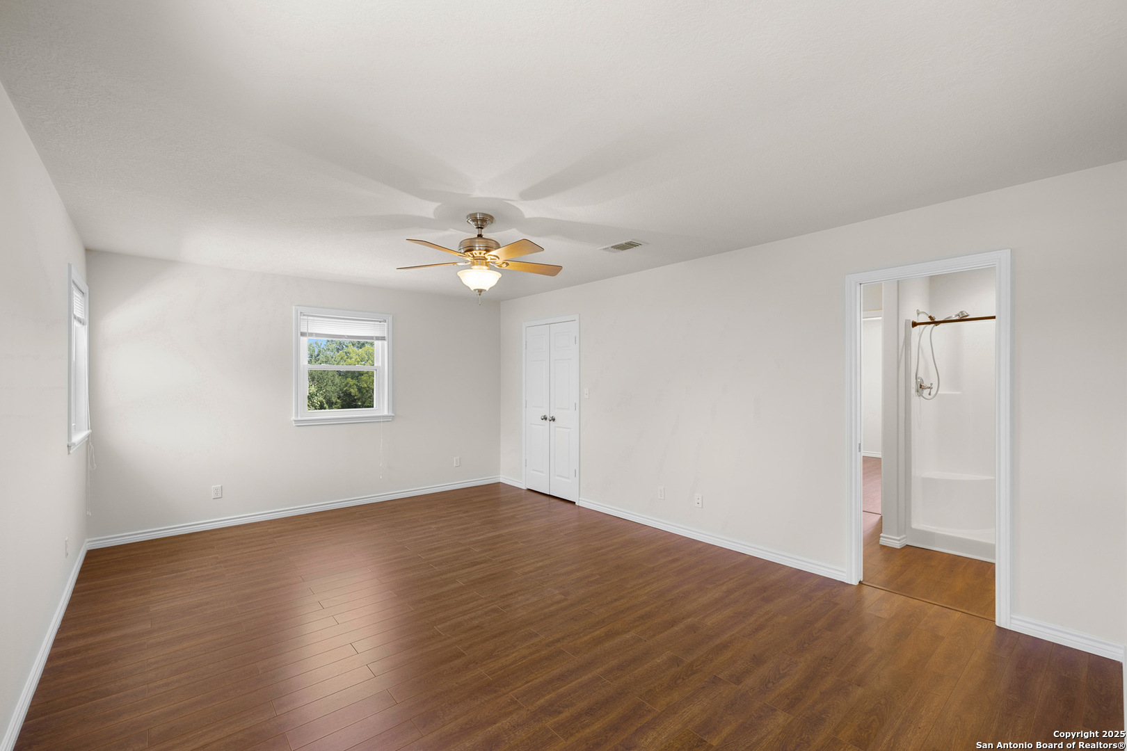 5450 Mazurek Road Schulenburg, TX 78956 - Photo 32 of 68 a view of an empty room with wooden floor and a window