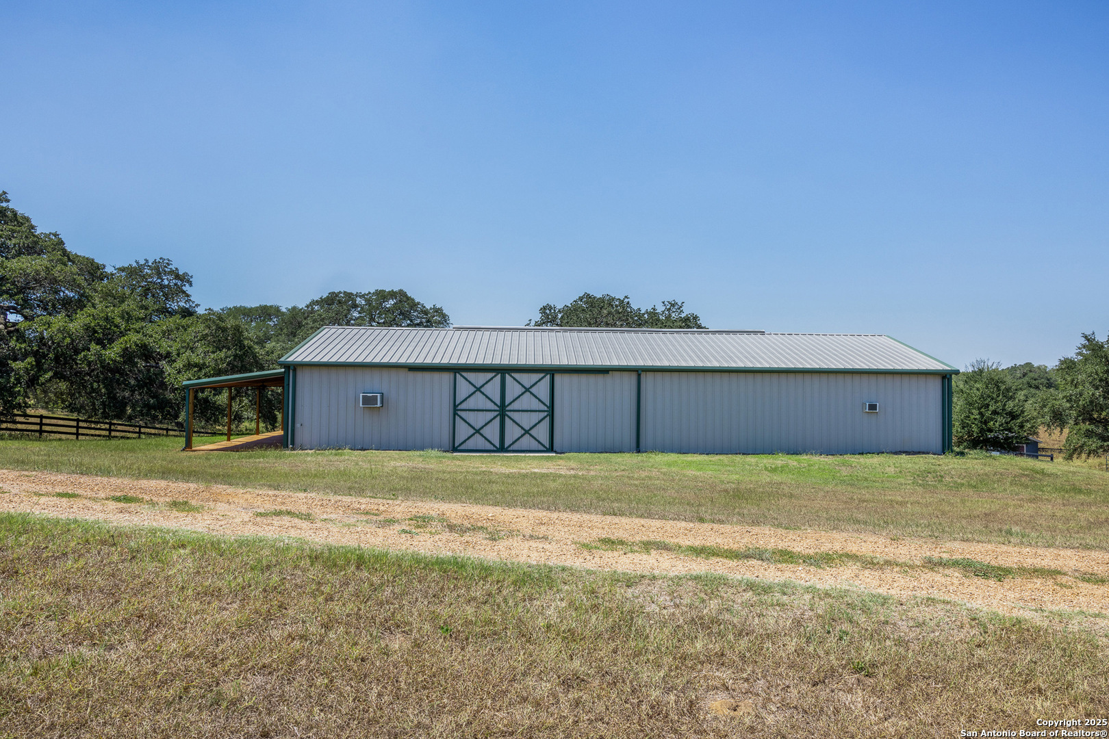 5450 Mazurek Road Schulenburg, TX 78956 - Photo 34 of 68 a view of a big house with a yard and large tree