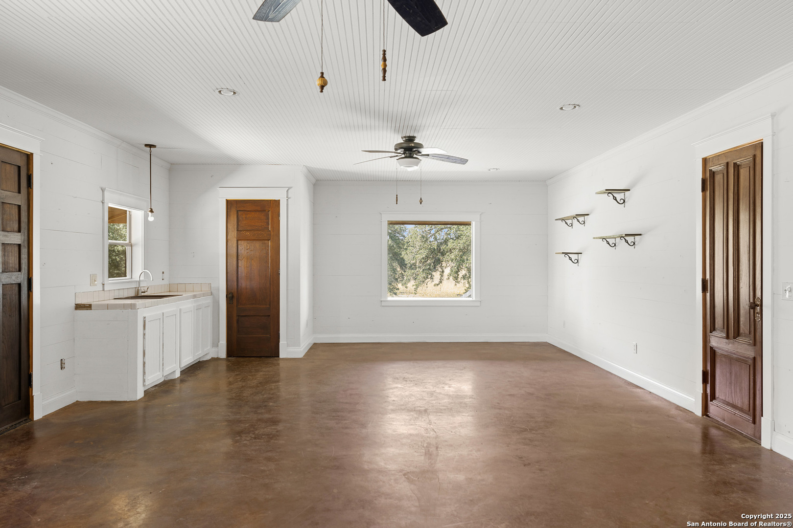 5450 Mazurek Road Schulenburg, TX 78956 - Photo 46 of 68 a view of a kitchen with a sink and refrigerator