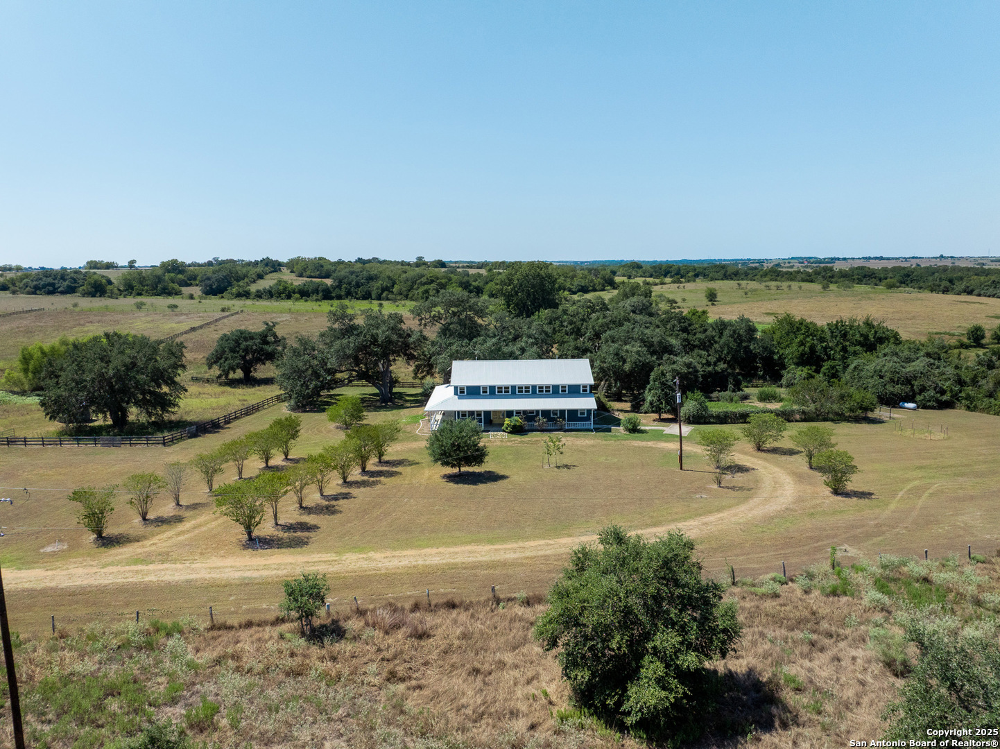 5450 Mazurek Road Schulenburg, TX 78956 - Photo 53 of 68 a view of a lake with a house in the background