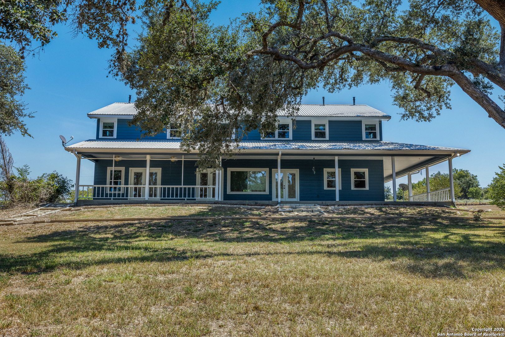 5450 Mazurek Road Schulenburg, TX 78956 - Photo 6 of 68 a front view of a house with a garden