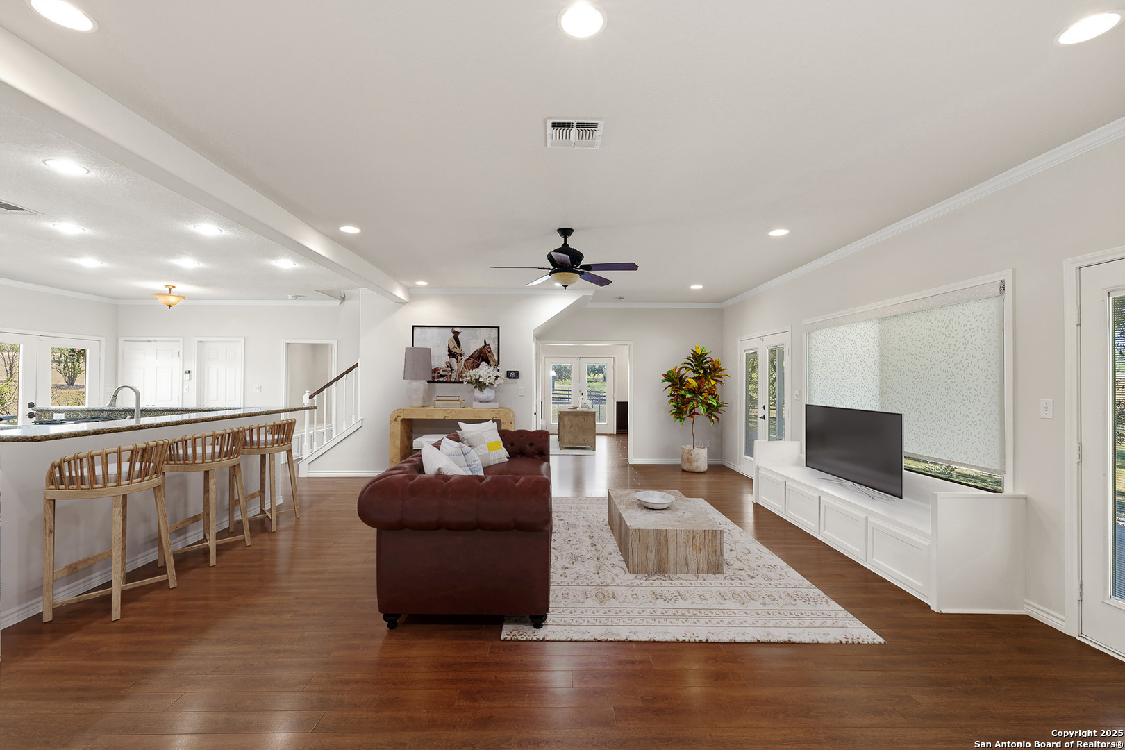 5450 Mazurek Road Schulenburg, TX 78956 - Photo 10 of 68 a living room with furniture a flat screen tv and kitchen view