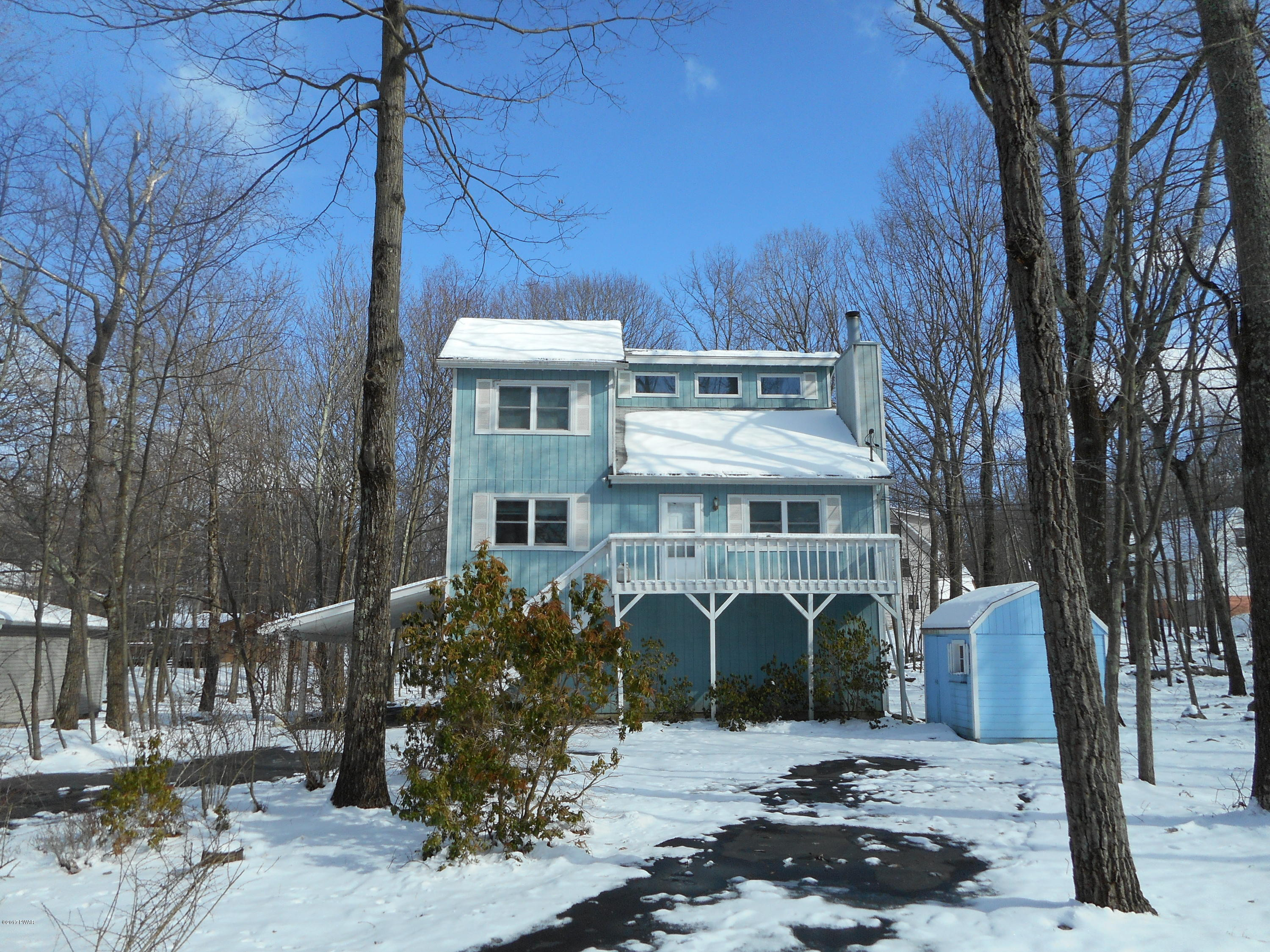 262 High Ridge Road Dingmans Ferry, PA 18328 - Photo 2 of 21 a front view of a house with garden